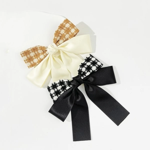 Houndstooth bow hair clips set in satin and tweed fabric with vintage aesthetic