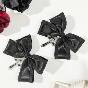 Gothic black satin hair clips with ruffled edges and silver cross pendants in detail