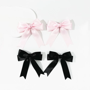 Elegant satin bow hair clips set in pink and black colors with long ribbon streamers