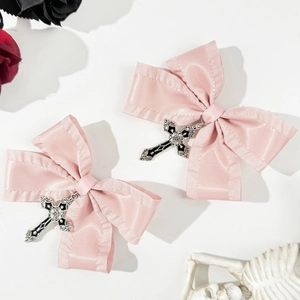 Pink ribbon hair clips with gothic cross charms and dark rose decorative background