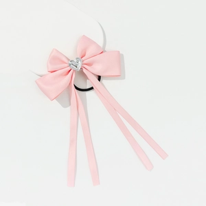 Sweet pink ribbon bow hair tie with silver heart charm and long satin streamers