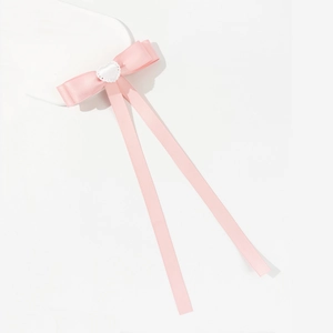 Pink satin bow hair clip with heart lace detail and long ribbon tails for women