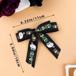 Detail of 4.33 inch Halloween hair bow with ghost prints and Happy Halloween text
