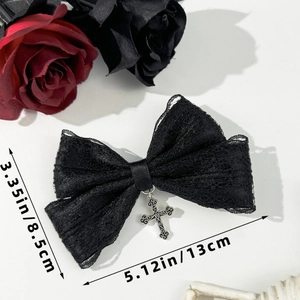 Detail view of black lace bow hair clip with silver cross pendant and size dimensions
