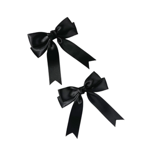 Pair of elegant black satin bow hair clips for women with a smooth and glossy finish