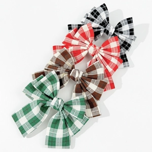 Classic plaid bow hair clips in four colors with premium woven texture on white background