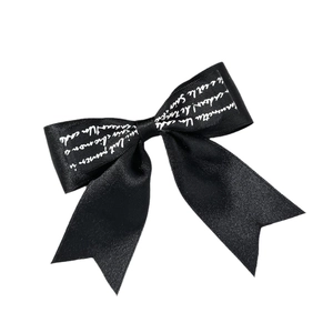Retro black satin bow hair clip with white cursive script letters for women