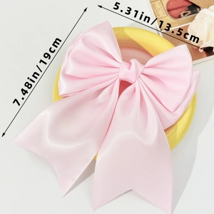Pink satin bow hair clip detailed dimensions 19x13.5cm shown on elegant vintage props