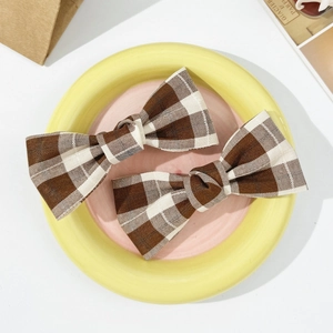 Set of two vintage brown plaid bow hair clips for women in a retro aesthetic style