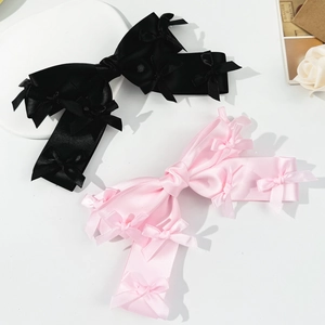 Elegant satin bow hair clips in pink and black featuring mini butterfly accents