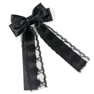 Elegant black satin bow hair clip with long lace embroidered ribbons on white background