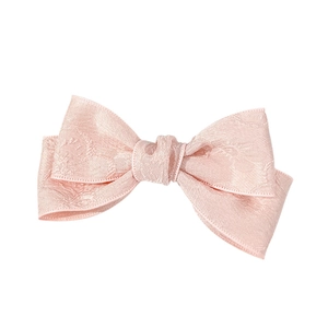 Elegant light pink bow hair clip with vintage jacquard texture for a graceful feminine look
