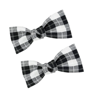 Set of two vintage plaid bow hair clips with classic black and white checkered pattern