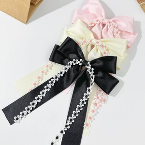 Floral ribbon bow hair clips set with lace trim and long tassels in sweet romantic style