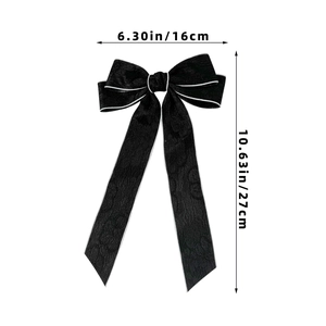 Detail view of black lace bow hair clip showing size dimensions 16cm width and 27cm length