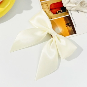 Cream satin bow hair clip with double-layer design in a French minimalist style