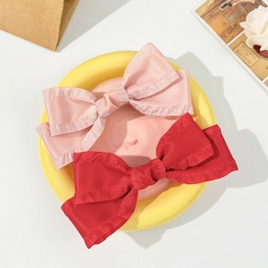 Elegant satin bow hair clips set in pink and red with ruffled edges for women