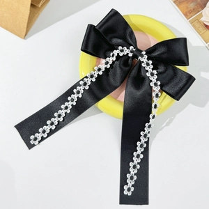 Elegant black satin bow hair clip with white floral lace embroidery and long tassels