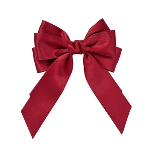 Elegant deep red satin bow hair clip with multi-layered design and smooth glossy texture