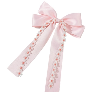 Pink silk bow hair clip with lace daisy embroidery and long flowing ribbons