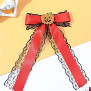 Halloween red ribbon hair bow with black lace edges and a glitter pumpkin centerpiece