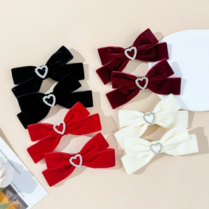 8-piece velvet bow hair clips set with heart rhinestones in red, burgundy, black, and cream