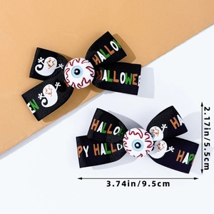 Detail of Halloween hair bows with Happy Halloween print and 3D eyeball centerpiece