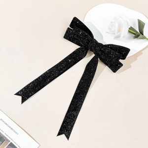 Elegant black bow hair clip with silver sparkles and long ribbons for women