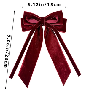 Detail showing red velvet bow hair clip dimensions 13cm width and 23cm length