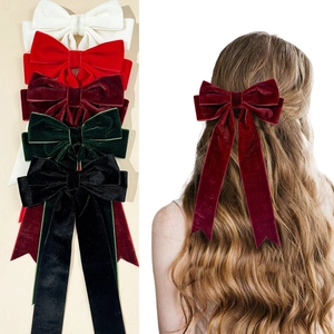 Elegant velvet ribbon bow hair clip in multiple colors for a retro vintage hair style