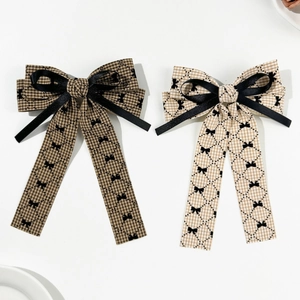 Elegant houndstooth bow hair clips set with long ribbons in brown and beige tones