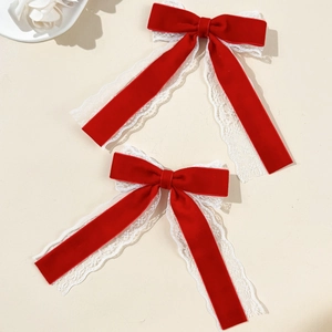 Elegant red velvet hair bow clip with delicate white lace trim in a vintage style