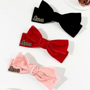 Three-piece velvet bow hair clips in black, red and pink with vintage metal Love letters