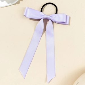 Detail of lavender satin ribbon bow hair tie with premium silky texture and black elastic band