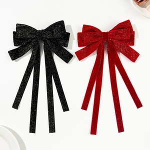 Elegant velvet bow hair clips in red and black with glittering metallic threads