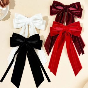 Elegant velvet bow hair clips with long ribbons in red, burgundy, black, and white