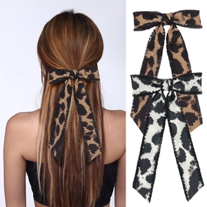 Leopard print bow hair clip with long tails in brown and black white patterns