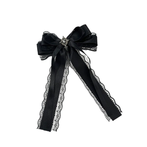 Gothic Lolita black satin bow hair clip with vintage grey gem and long white lace ribbons