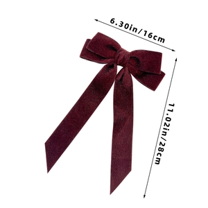 Detail showing plush burgundy velvet bow hair clip dimensions 16x28cm on white background