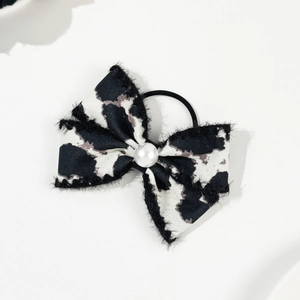 Elegant leopard bow hair tie with pearl accent for women, chic vintage style accessory