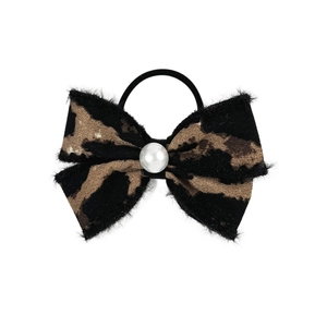 Leopard print bow hair tie with pearl accent and elastic band on white background