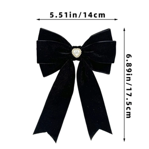 Detail of black velvet bow hair clip with heart pearl and rhinestone trim, 14cm x 17.5cm