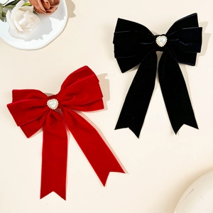 Elegant velvet bow hair clips with heart-shaped pearls and rhinestones in red and black