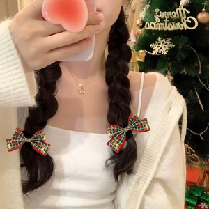 Lot de deux pinces à cheveux de Noël avec nœuds à carreaux rouges et verts et motifs dorés