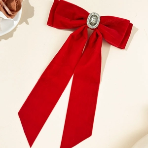 Elegant red velvet bow hair clip with vintage pearl center and long flowing streamers