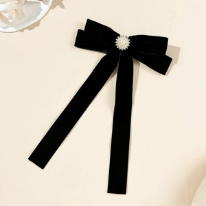 Vintage black velvet bow hair clip with central pearl and rhinestones decoration