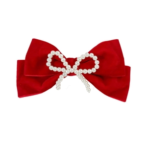 Elegant red velvet bow hair clip with pearl centerpiece for vintage style hairstyles