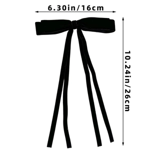 Detailed view of long velvet ribbon hair bow with dimensions 16cm width and 26cm length
