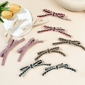 Handmade woven bow hair clips in multiple colors with metallic duckbill base for women