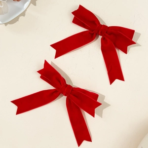 Set of two red velvet bow hair clips with elegant swallowtail design for women